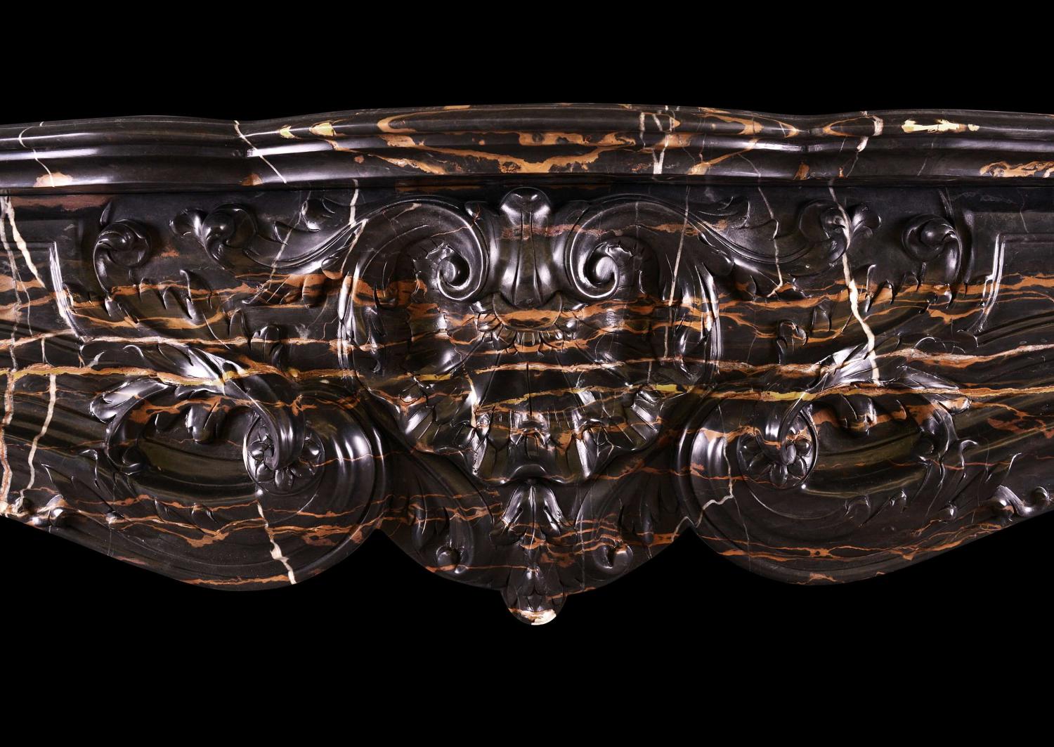 A striking Louis XV style marble fireplace
