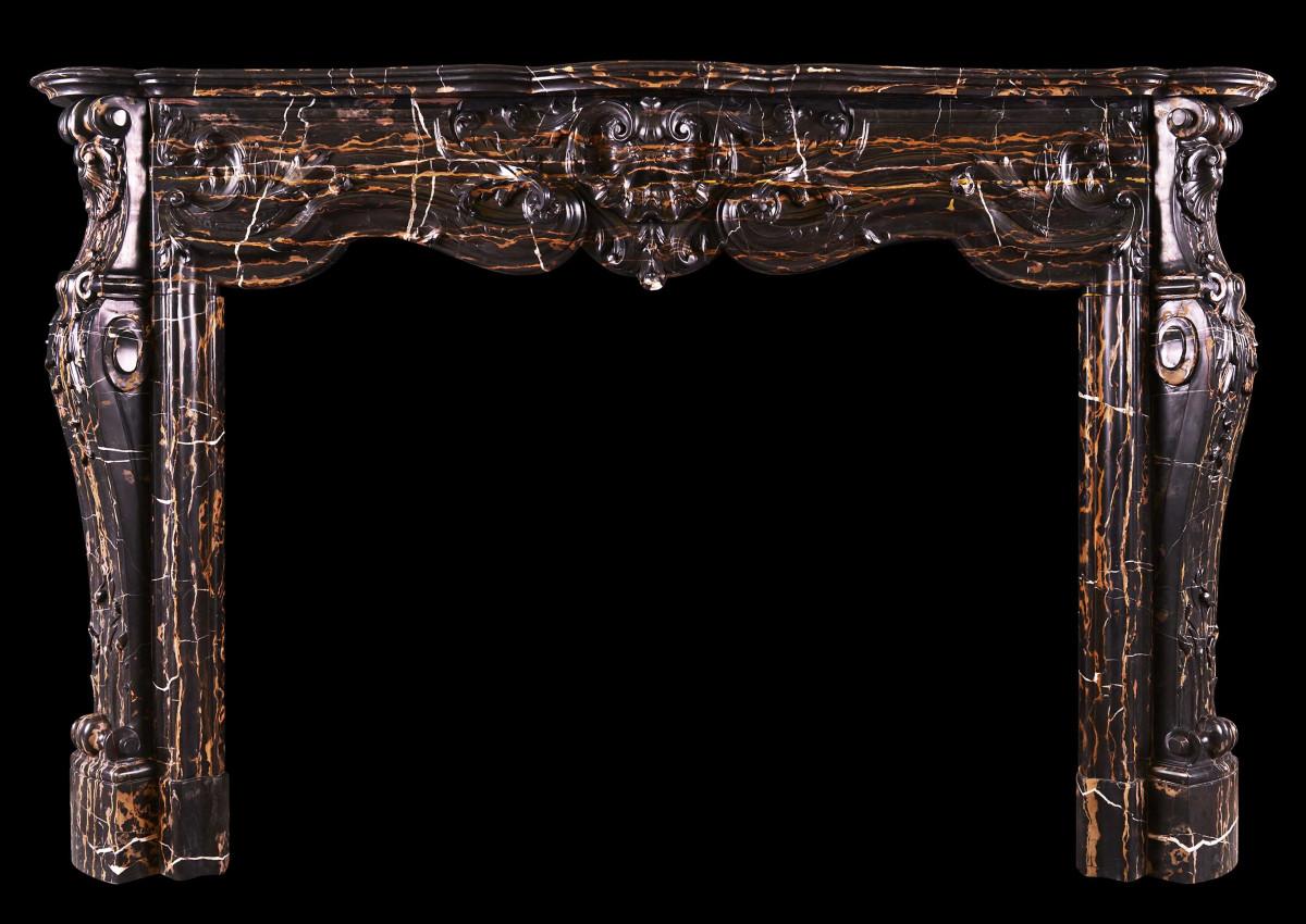 A striking Louis XV style marble fireplace