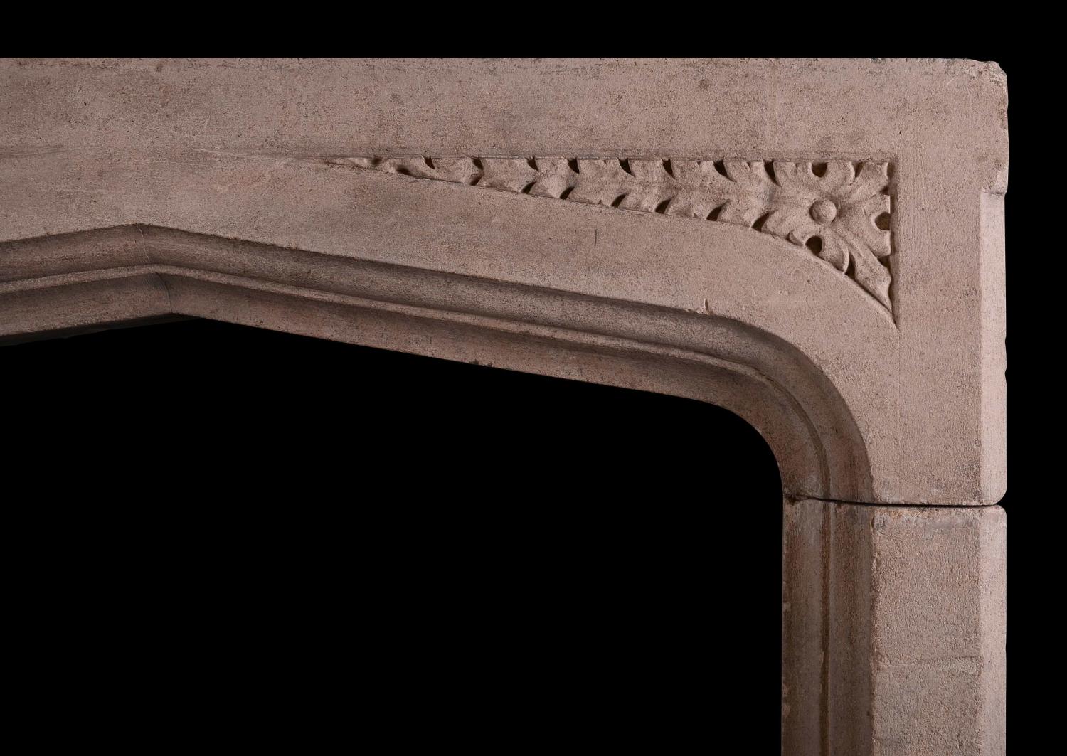An English stone fireplace in the Gothic style
