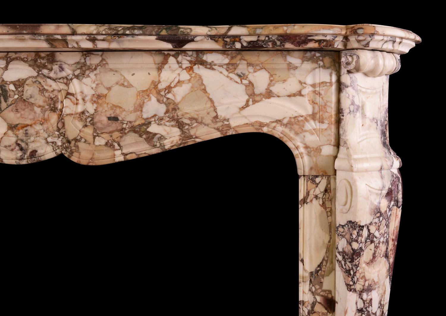 A French Louis XV style fireplace in Brèche de Bénou marble