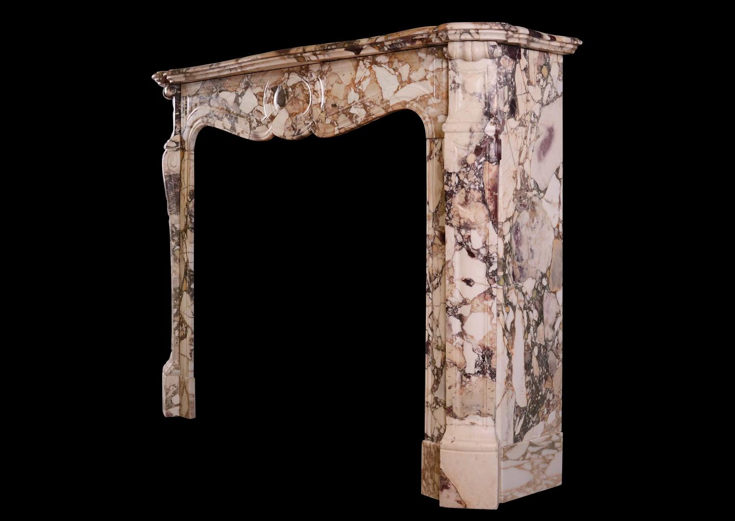 A French Louis XV style fireplace in Brèche de Bénou marble