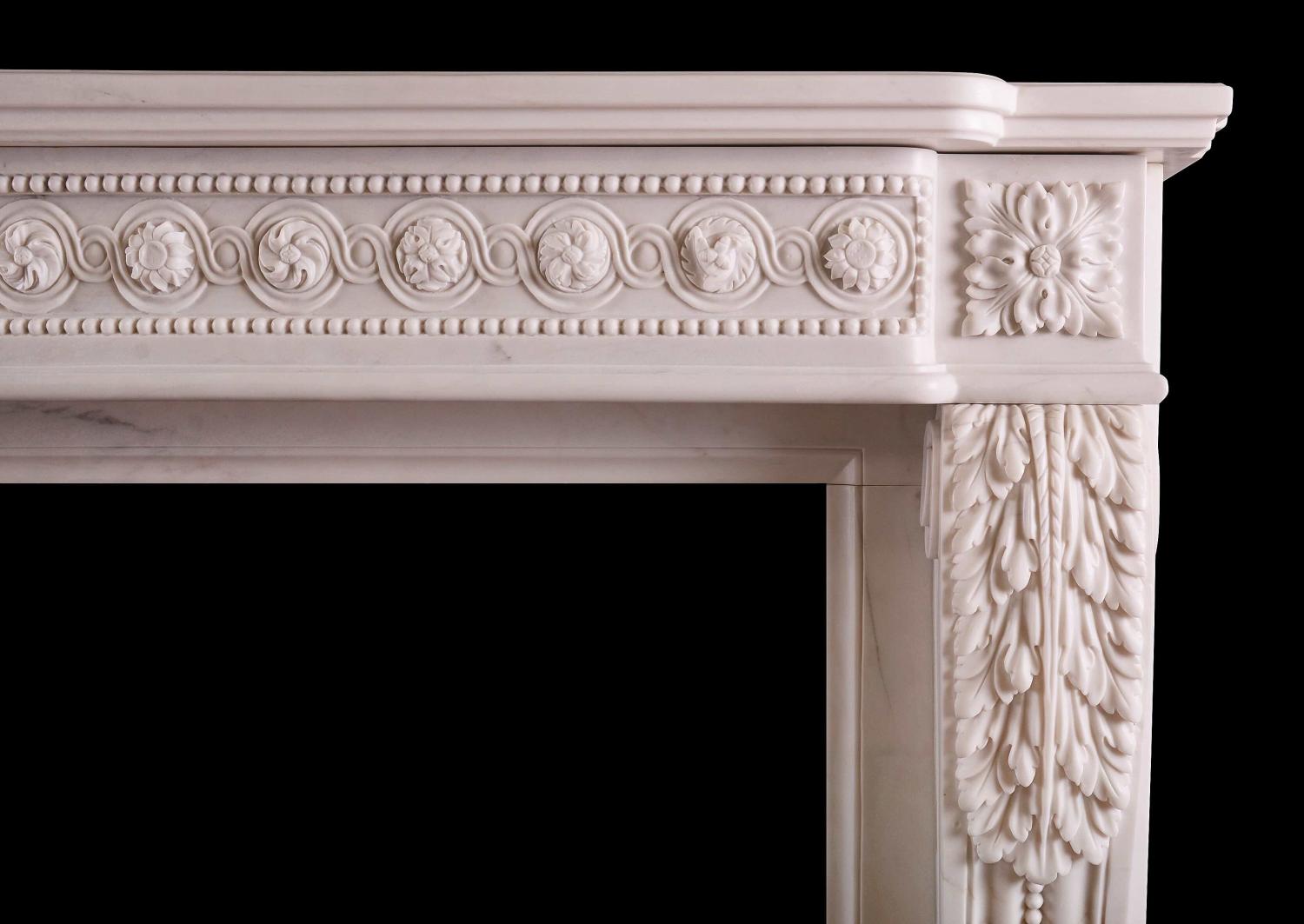A French white marble fireplace in the Louis XVI manner