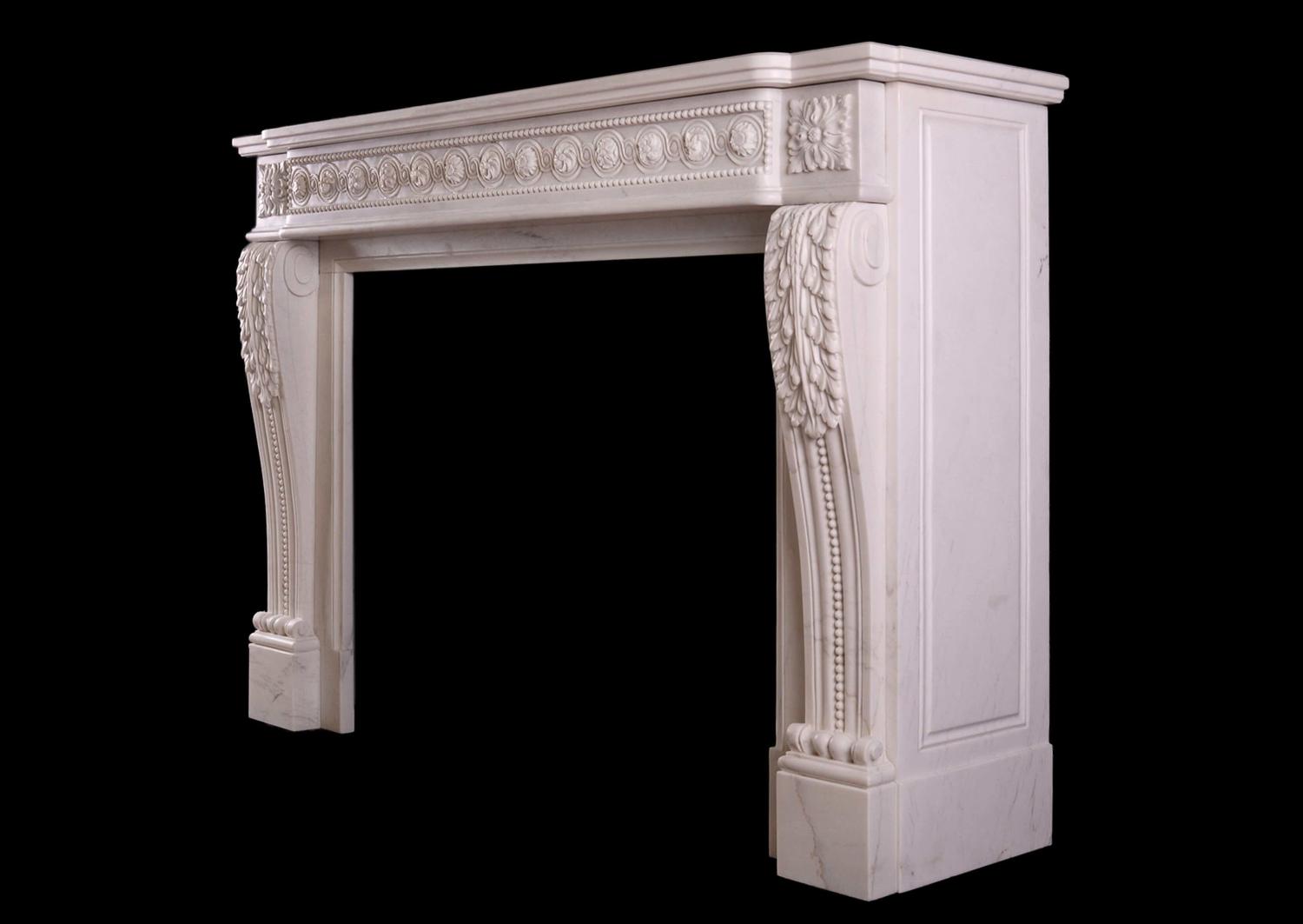 A French white marble fireplace in the Louis XVI manner