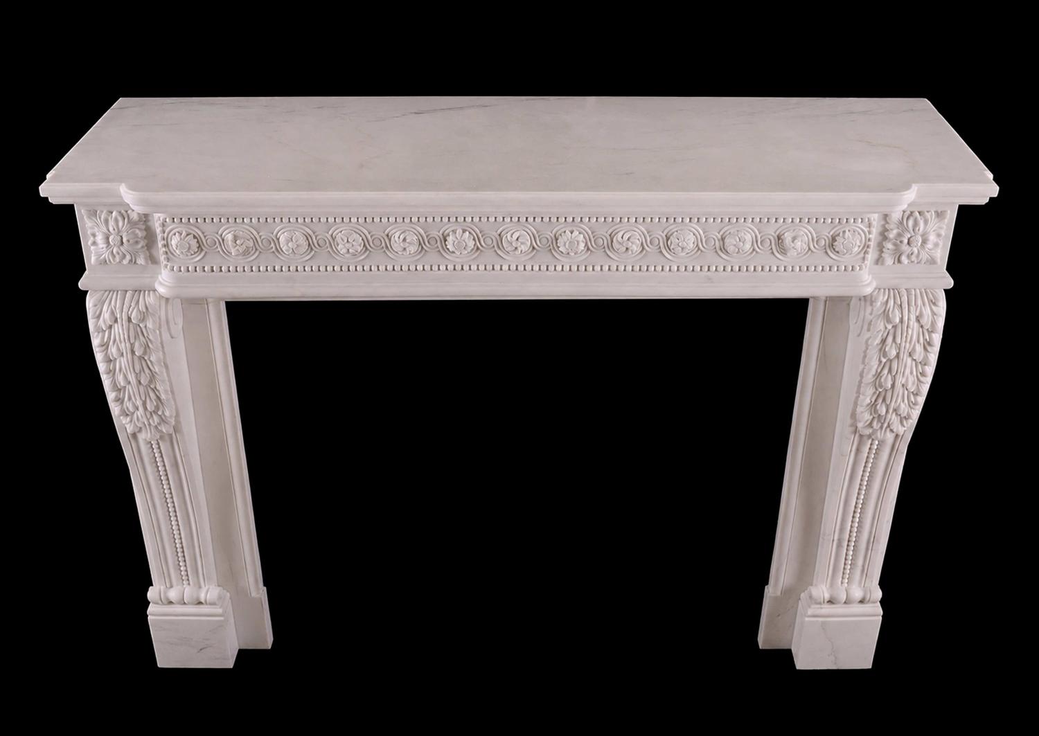 A French white marble fireplace in the Louis XVI manner