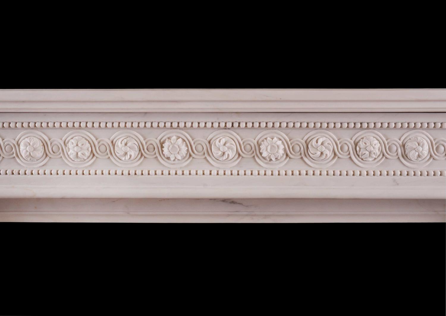 A French white marble fireplace in the Louis XVI manner