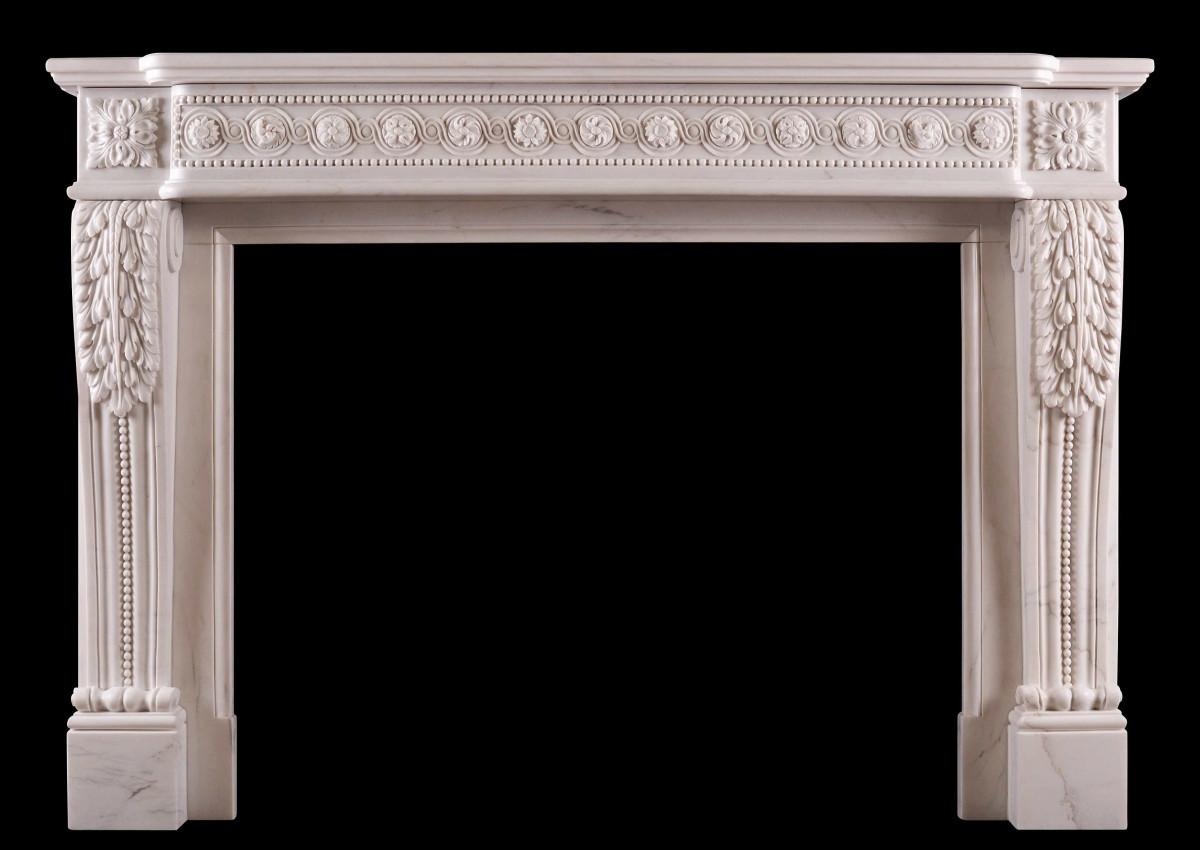 A French white marble fireplace in the Louis XVI manner