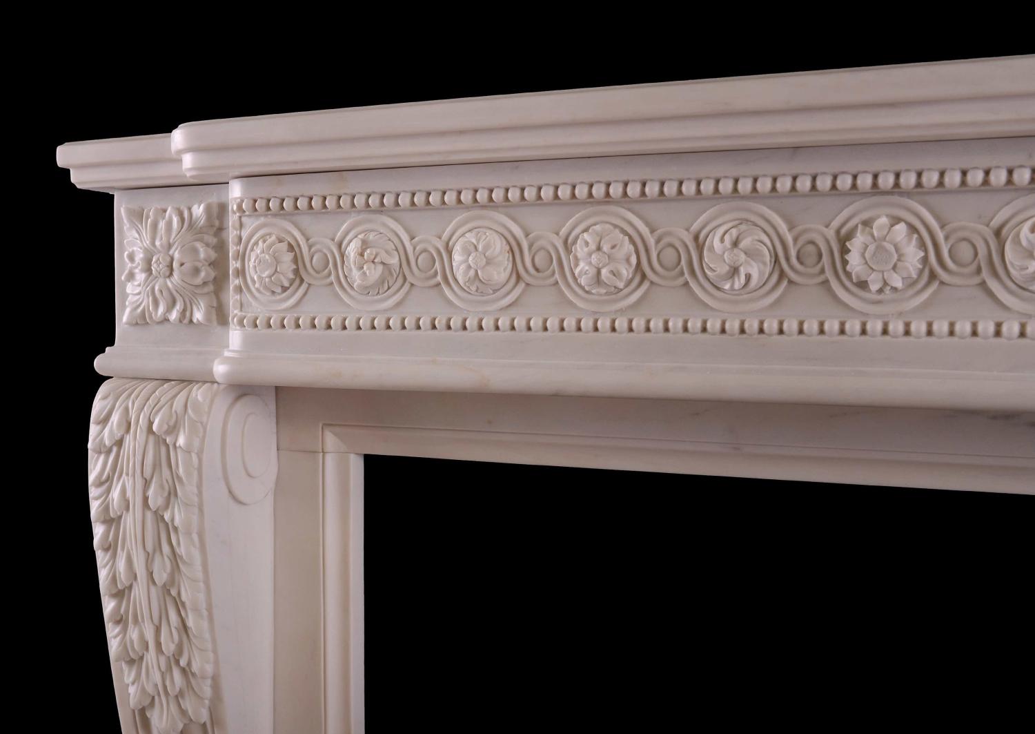 A French white marble fireplace in the Louis XVI manner