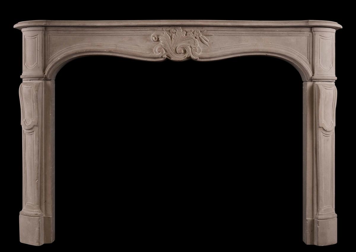 A French Louis XV limestone fireplace
