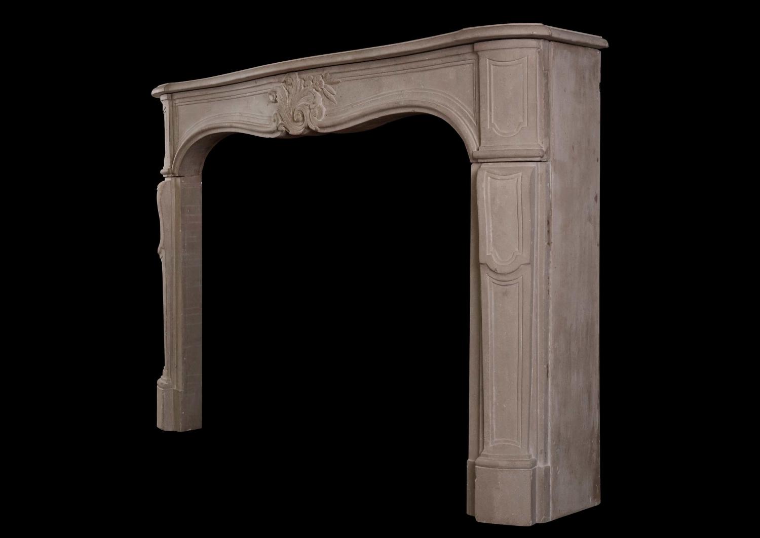 A French Louis XV limestone fireplace