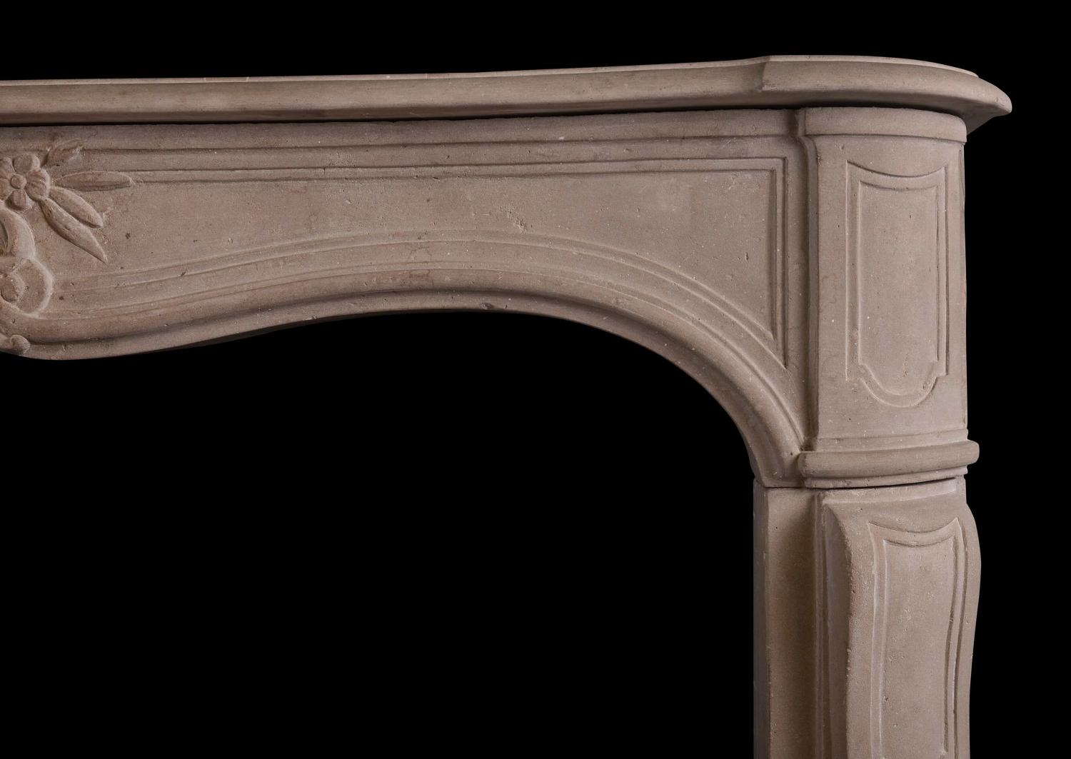 A French Louis XV limestone fireplace