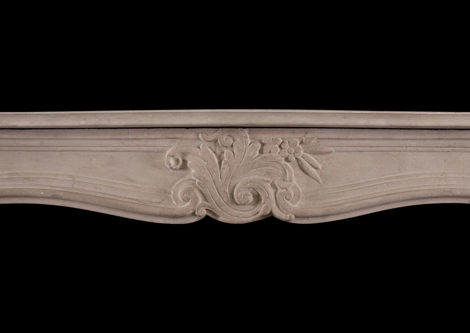 A French Louis XV limestone fireplace