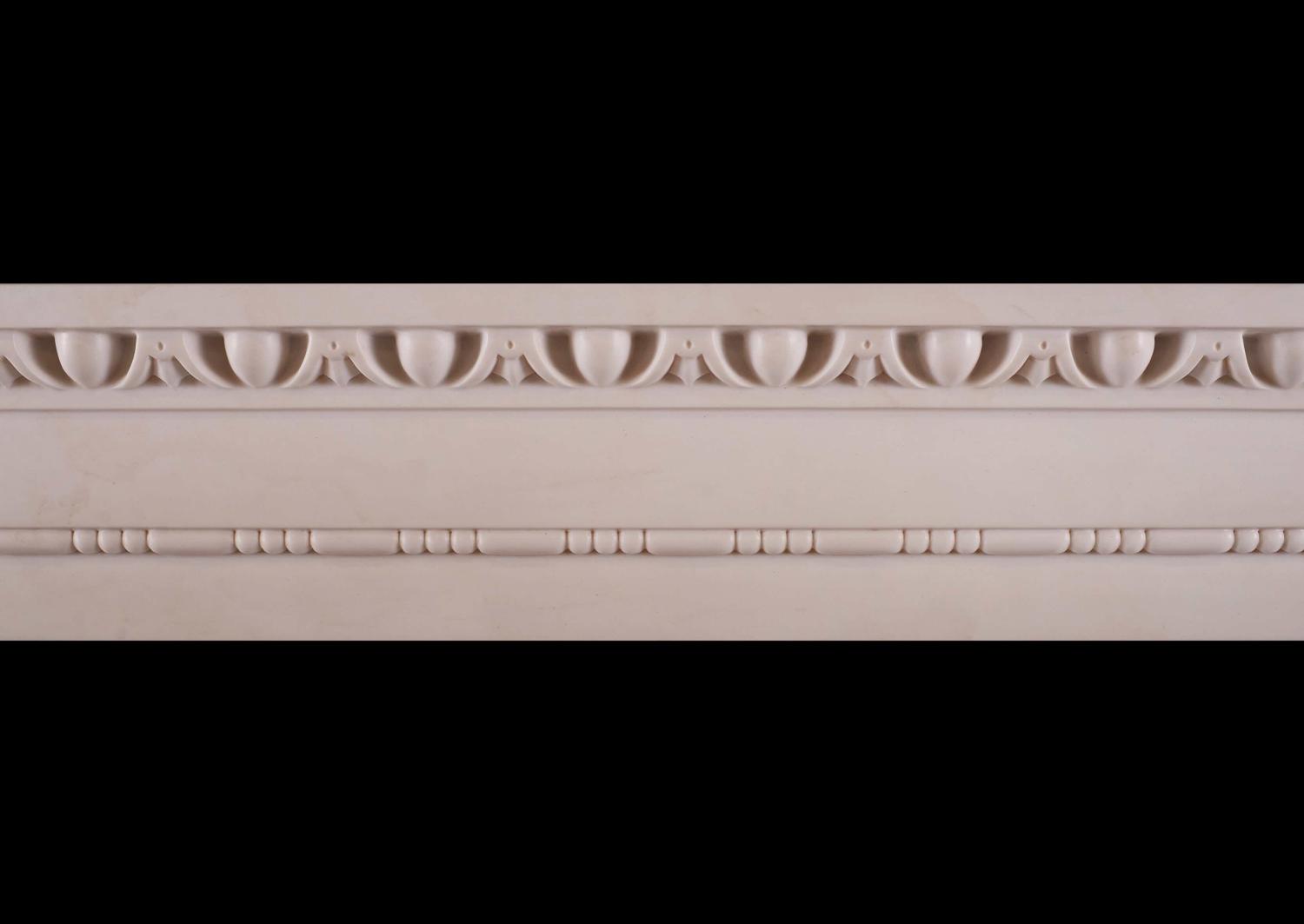 A white marble fireplace in the architectural style