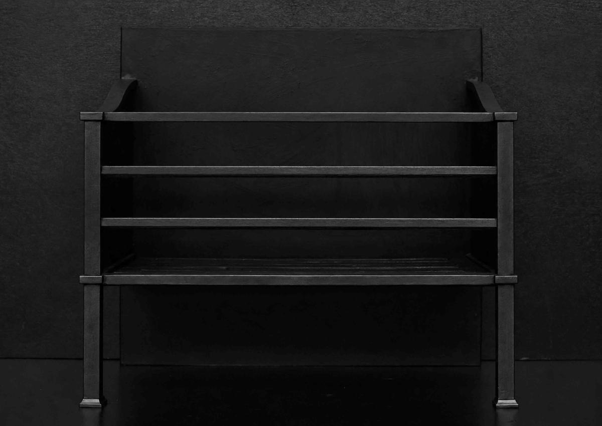 A simple steel firegrate in a blacked lead finish