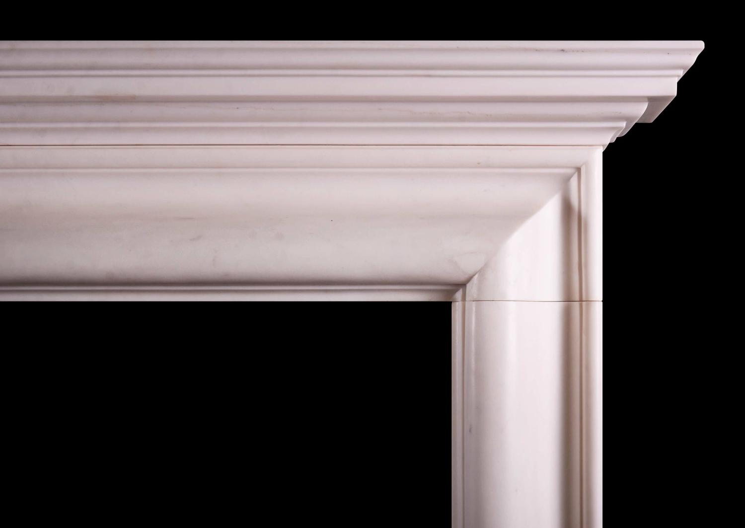 An architectural white marble fireplace
